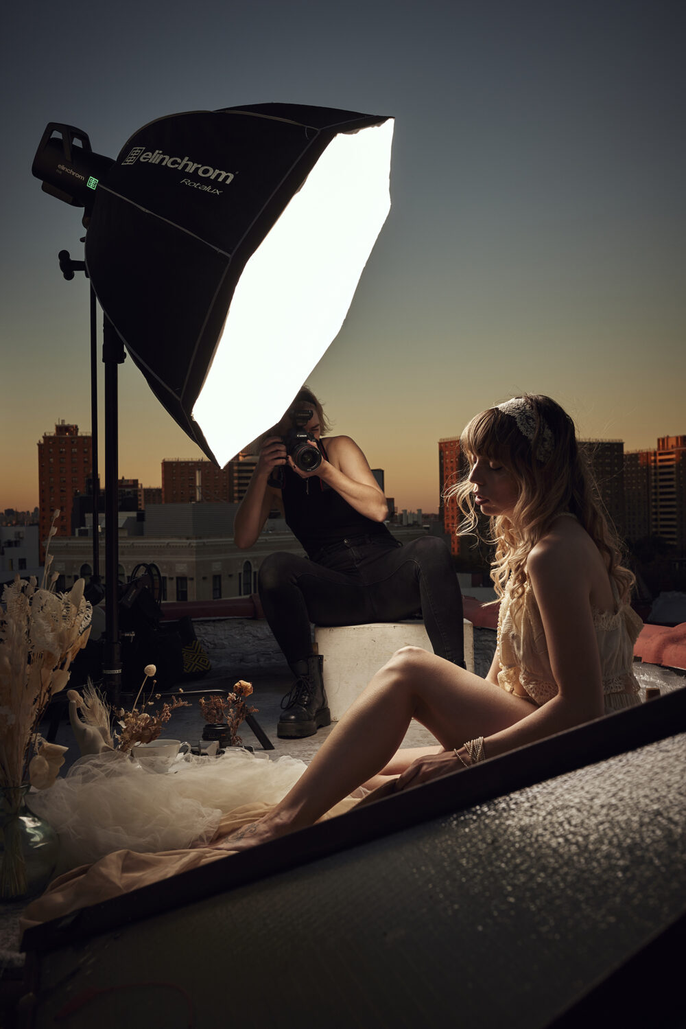 Behind the scene of a photoshoot showing Elinchrom FIVE  female model and photographer Emily Teague