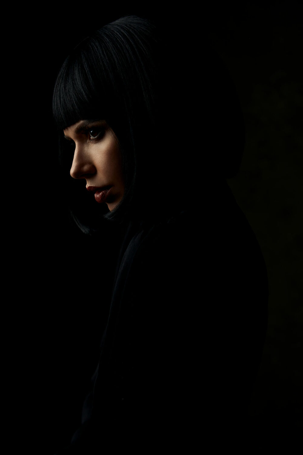 Female model with low key light by Emily Teague