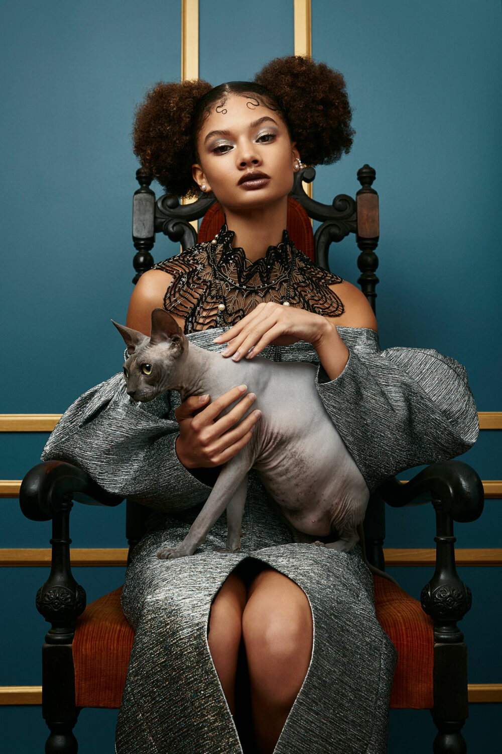 female model with a sphinx cat by photographer Emily Teague