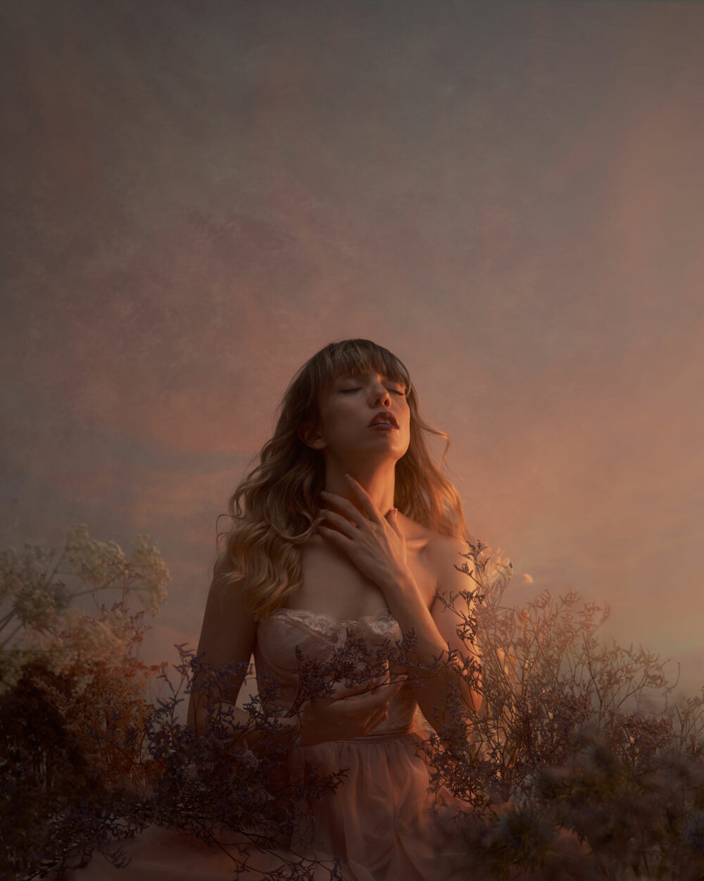 Female model with dried flowers in a warm light